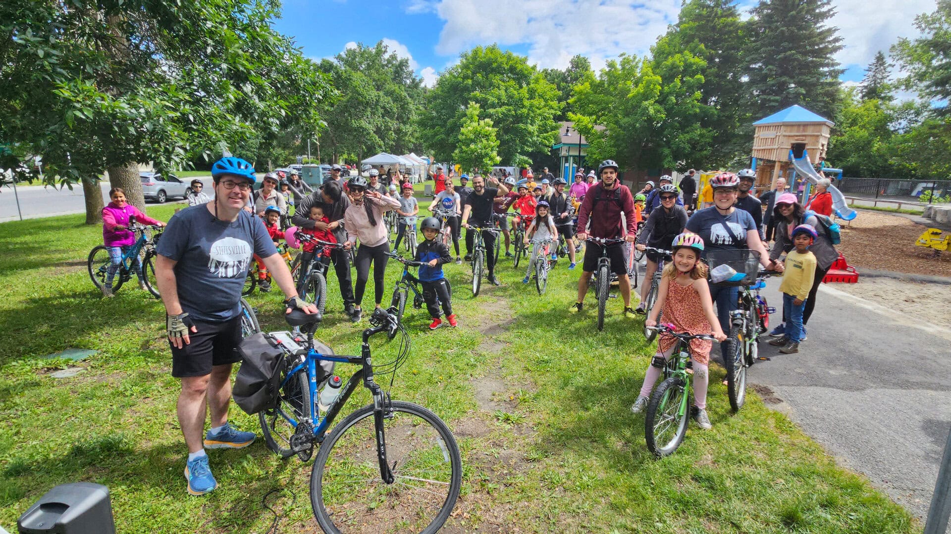 Kids and adults with bikes at Village Square Park at the 2024 Stittsville Family Bike Ride