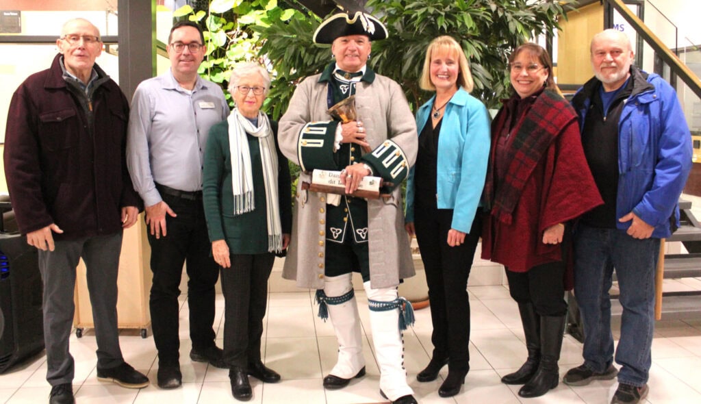 25 years at CARDELREC-Goulbourn. Group photo: Bob Mills, Councillor Glen, recreation committee member Lyn Aresnault, Town Crier, Janet Stavinga, Louise Beggs, recreation committee member Peter Sturrus.