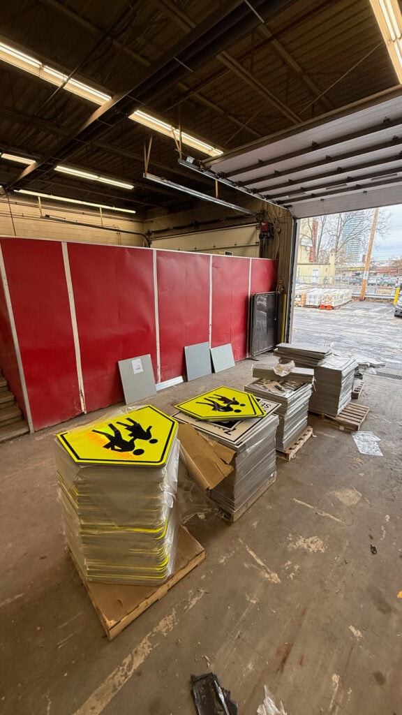Staff had just received a shipment of new school zone signage from the province, meant to replace speed cameras. Unfortunately, the signs are too big and heavy to be mounted on standard traffic poles