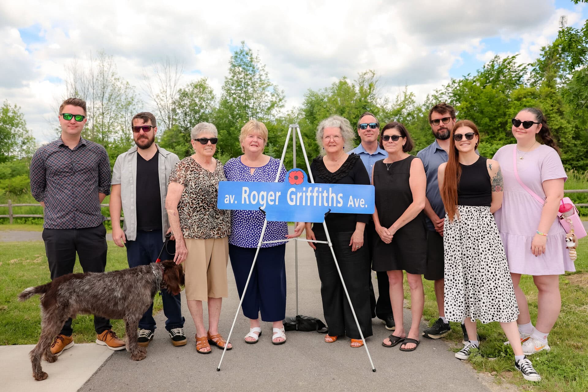 Roger Griffiths Avenue street naming ceremony. Family photo around the sign