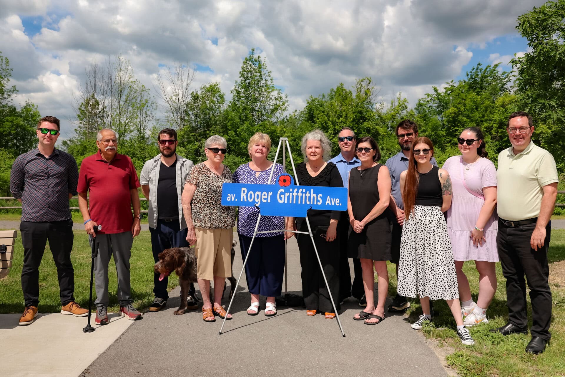 Roger Griffiths Avenue street naming ceremony. Family and friends around the sign