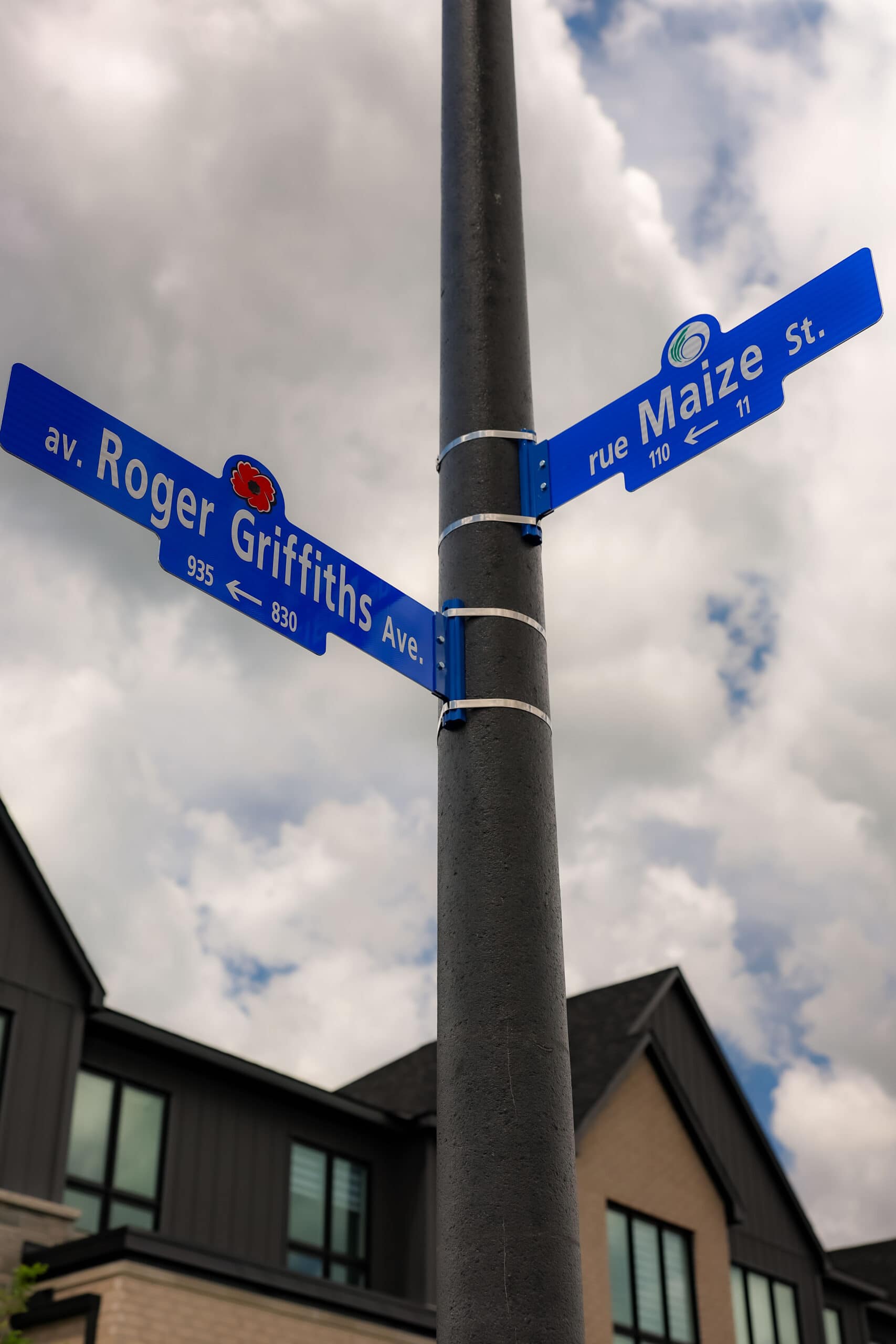 Roger Griffiths Avenue street naming ceremony. Street blade sign at Maize Street